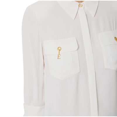 Acquista subito la Camicia Donna, in viscosa, spalline imbottite, maniche a tre quarti e dettagli metallo in oro, firmata Elisabetta Franchi su Old England: vieni a scoprire tutta la collezione sul nostro sito