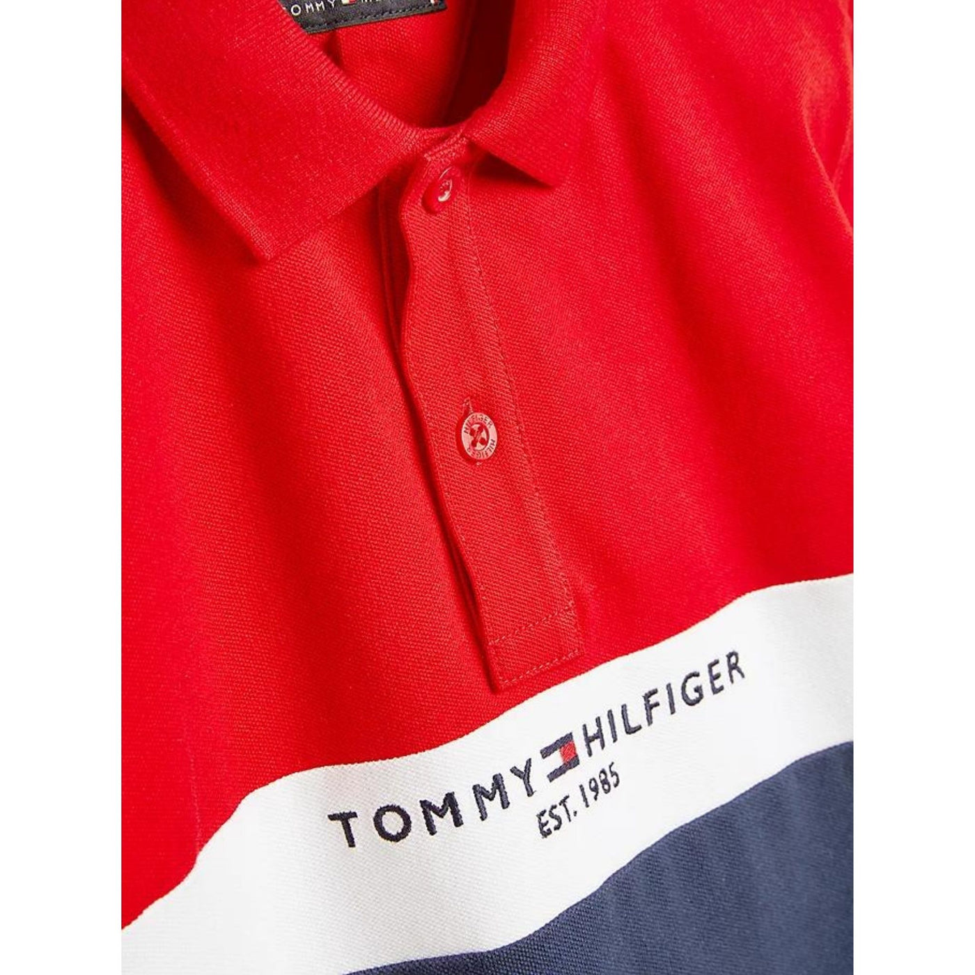 Polo bambino Tommy Hilfiger con motivo colore a blocchi e logo brand frontale.